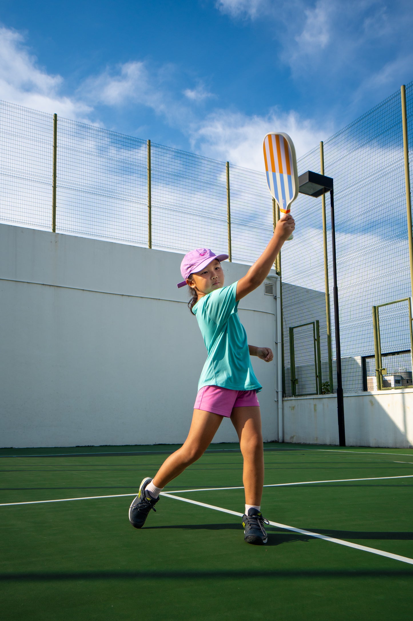 beige, periwinkle, lavender and orange striped pickleball paddle