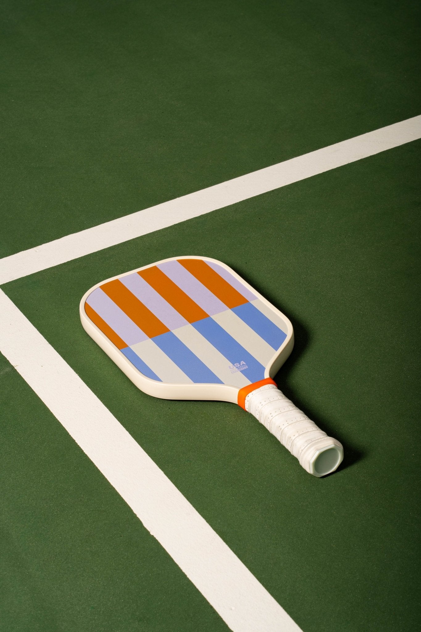 beige, periwinkle, lavender and orange striped pickleball paddle