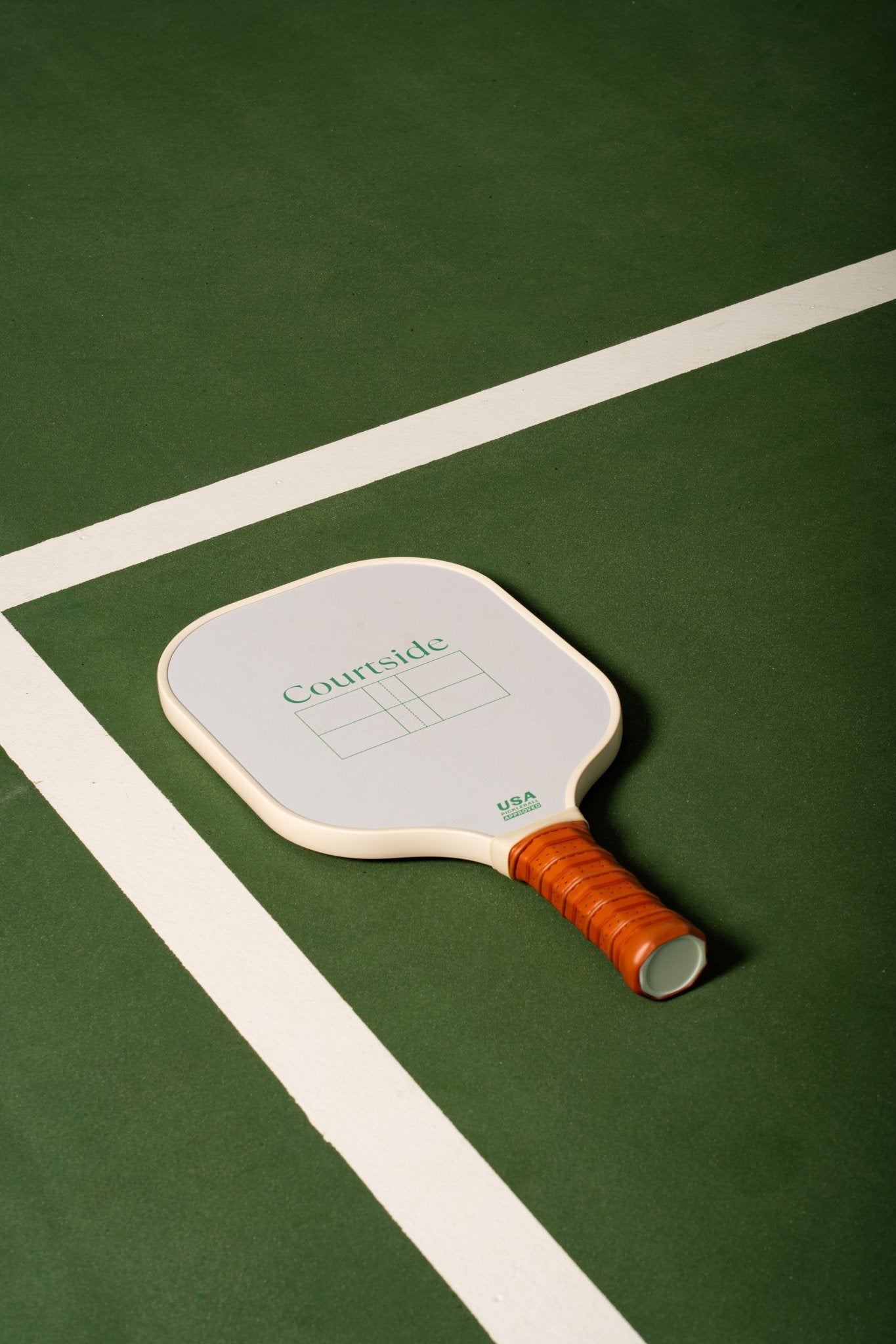 white pickleball ball with cartoon pickles